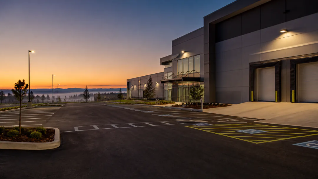Completed commercial parking and loading area with fresh markings and clean transitions